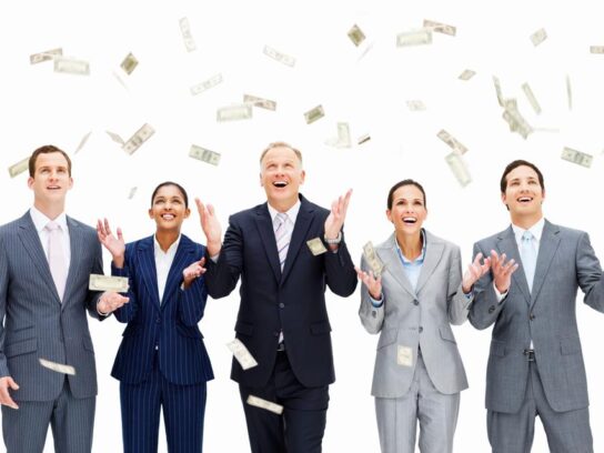 photo of business people in suits with paper money floating down