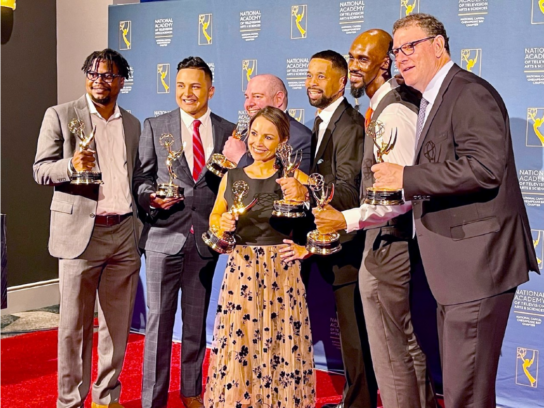 photo of MCM Emmy awardees holding statues