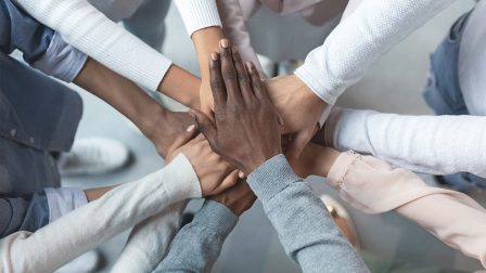 photo of hands joining together