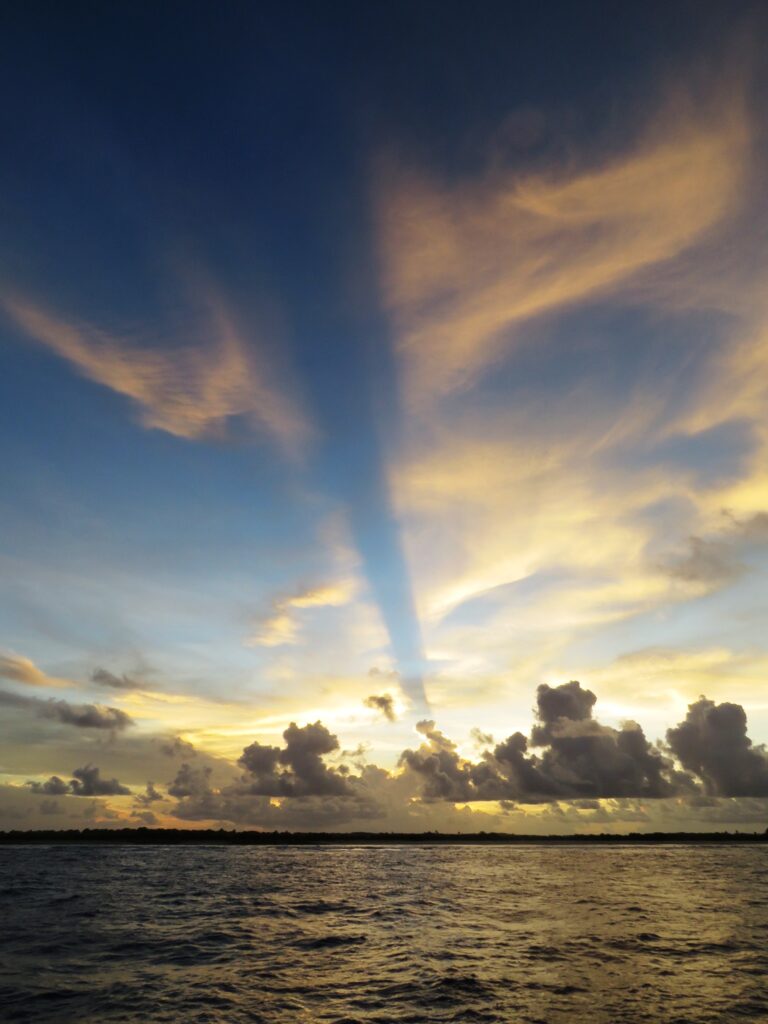photo of ray pointing to uninhabited Niku atoll
