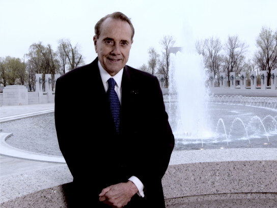 photo of U.S. Senator Bob Dole in front of the WWII Memorial in Washington, D.C.