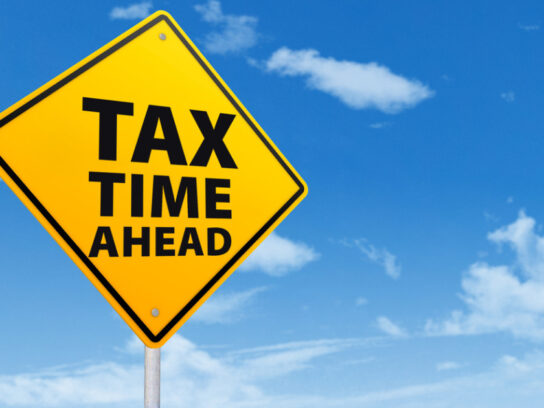 photo of street sign warning tax time ahead