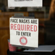 photo of sign on door face masks are required to enter