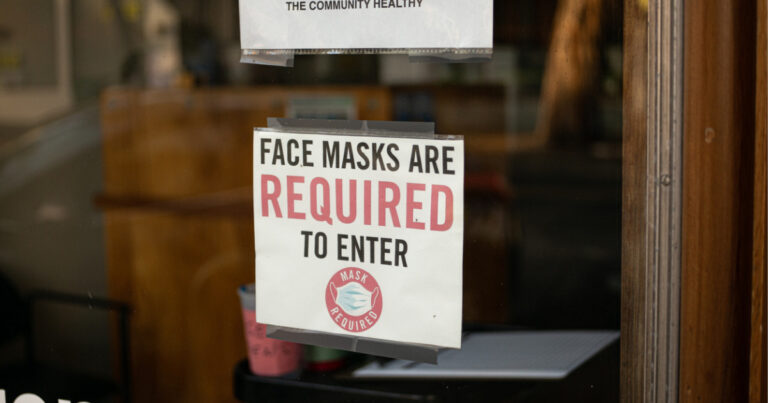 photo of sign on door face masks are required to enter