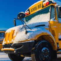 photo of school bus in the winter with snow