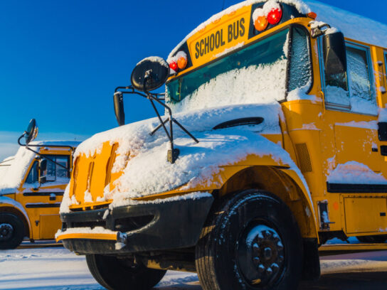 photo of school bus in the winter with snow