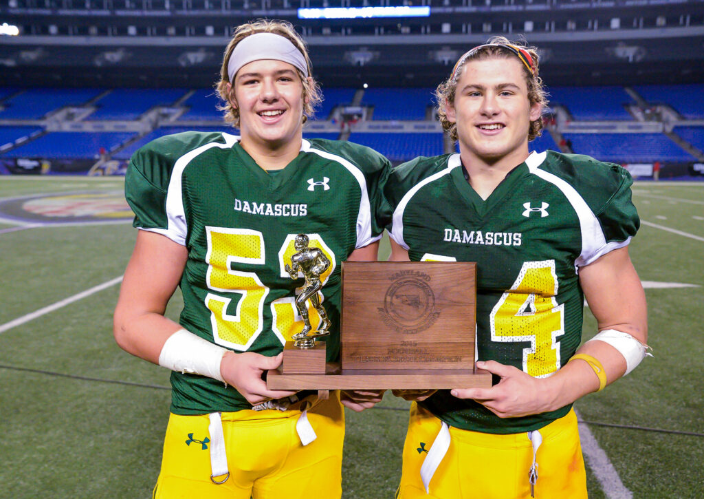 photo of Jake Funk holding the 2015 MD 3A championship trophy