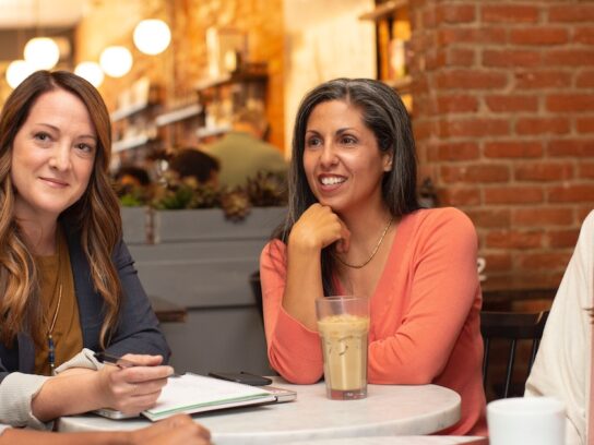 Photo of women talking at restaurant