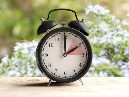 photo of daylight saving time european daylight saving time alarm clock on wooden desk blur spring picture id1128684837