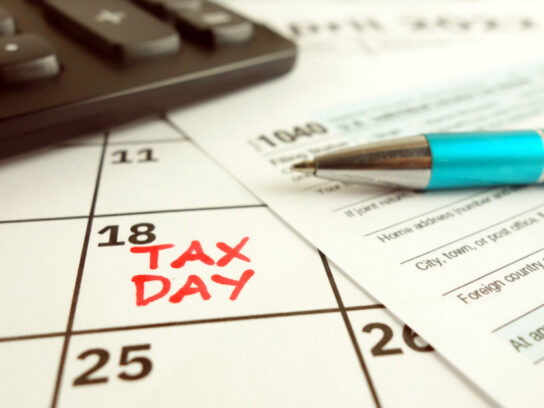 photo of tax payment day marked on a calendar april 18 2022 with 1040 form picture-id1368041241