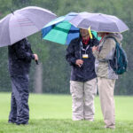photo of spectators under umbrellas gallery at the 2022 Wells Fargo Championship with an 8 under par at TPC Potomac at Avenel Farms