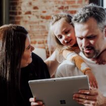 photo of parents with young daughter