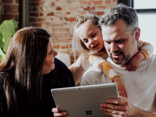 photo of parents with young daughter