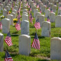 photo of military grave markers with flags for memorial day