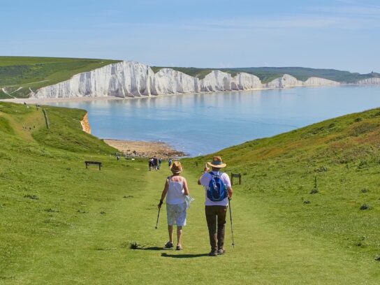 photo of couple walking down a path