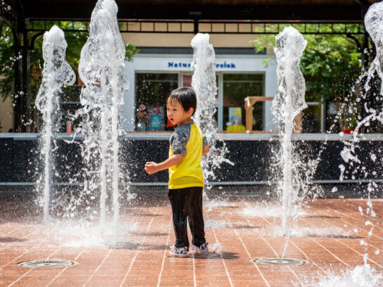 photo of child playing in water at Rockville Town Center