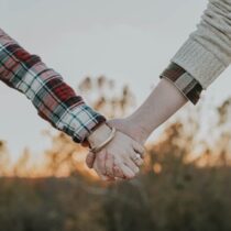 photo of couple holding hands