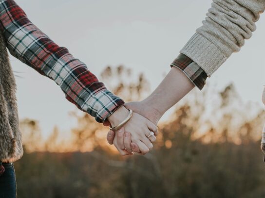 photo of couple holding hands