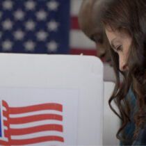 photo of woman and man voting