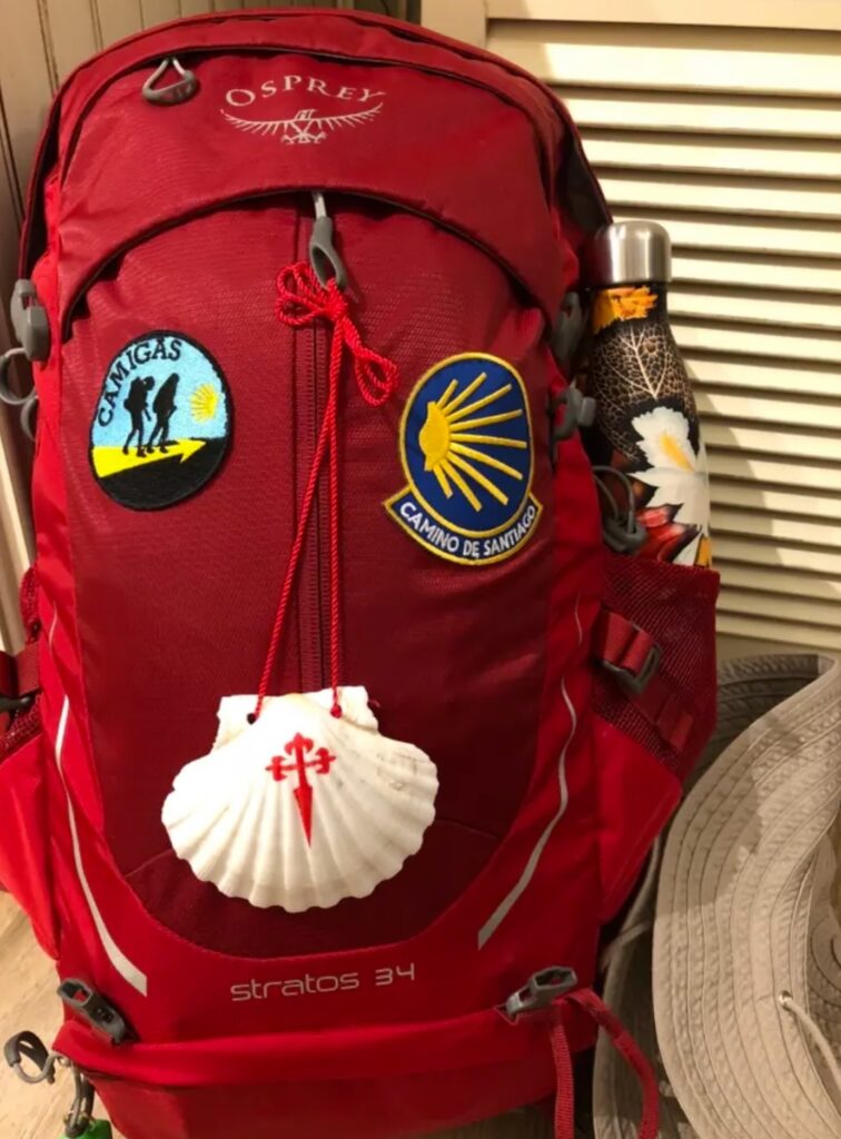 photo of backpack with pilgrim insignia