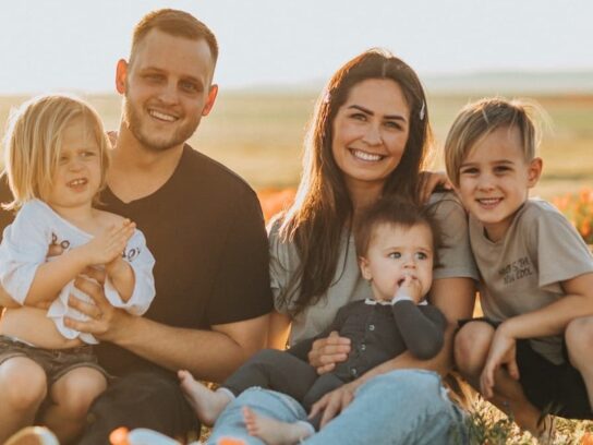 photo of family with three young children