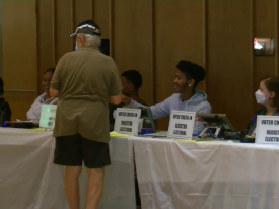 photo of election workers and voter at Silver Spring Civic Center