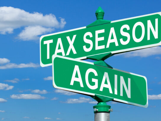 street sign with the words Tax Season Again