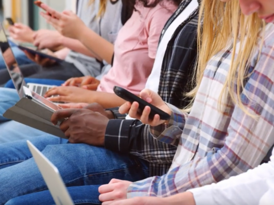 students on phones and mobile devices