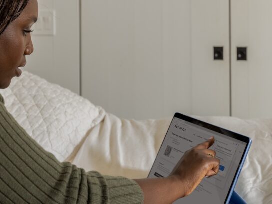 photo of woman working on a tablet