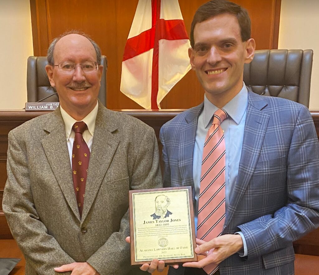 Author Lew Toulmin and his cousin James McPhillips, Esq. with the plaque honoring James Taylor Jones, MC, their common ancestor.