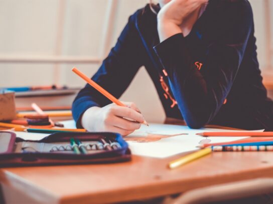 photo of teen student with pencil