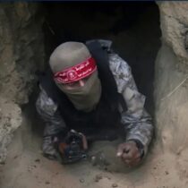 A Hamas fighter emerging from a Gaza tunnel.