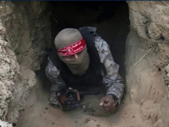 A Hamas fighter emerging from a Gaza tunnel.