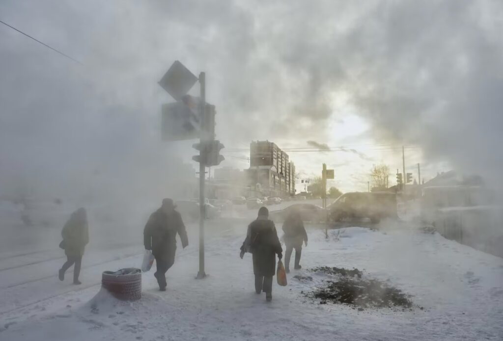 dense clouds of steam rise from broken water and heating pipes in Novosibirsk in southern Russia
